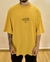 Camiseta Oversized VNTG Approve Smile Tape Logo Amarela