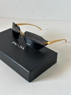 lentes prada negros con dorado