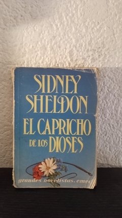 El capricho de los dioses (usado, detalle en canto y mala apertura) - Sheldon