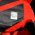 Camisa-masculina-Athletico Paranaense-home-titular-temporada-2023-2024-Umbro-vermelha-preto-faixas diagonais-gola redonda-punhos-escudo-logo-nuca-frase-calção-meiões. 