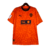  camisa-masculina-third-away-Puma-temporada-2023-2024-Valencia-laranja-estampa abstrata-raízes-união-identidade-escudo-felino-TM Real Estate Group-calção-meiões 