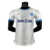 Camisa-player-Olympique-de-Marseille-temporada-2023-2024-titular-patrocínio-Puma-branco-cinza-rocha-calcária-gola-redonda-azul-celeste-escudo-calção-meiões. v