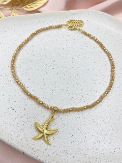 Colar dourado estrela do mar/cristal j99 na internet