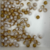 100 Bolas plásticas 8mm Dourada com Branca Texturizada - Bola passante na internet