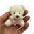 Ursinho pelúcia 7 cm bege com laço rosa sentado - Lembranças e decorações