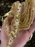 Manta de pedraria e cascalhos cor Creme com dourado 1 metro na internet