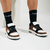 zapatillas marrones con cordones y medias negras marcas Harek fabricadas en Argentina