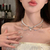 Imagen de Collar Doble perlado con moño - Acero de Titanio
