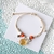 Pulsera con flor encapsulada