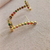 Ear cuff cravejado em zircônias coloridas na internet