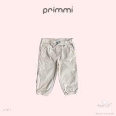 Pantalon beige. Marca: Primmi Talla: 18 meses