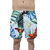 Shorts de praia com estampa tropical colorida, apresentando folhas verdes e flores em tons vibrantes.