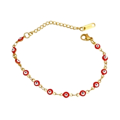 Pulsera ojitos rojos dorada - 0452P