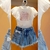 Conjunto Infantil Saia Short Jeans e Blusa com Tule Petit Cherie