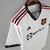 camisa-camiseta-manchester-united-reds-fc-2-ii-22-23-2022-2023-escudo-no-peito-adidas-torcedor-masculina-masculino-branco-branca-fora-visitante-away-reserva-team-viewer-patrocinio-gola-v-antony