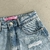 Short Saia Jeans Claro com Rasgo - loja online