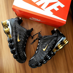Nike shox junior preto e dourado 2025