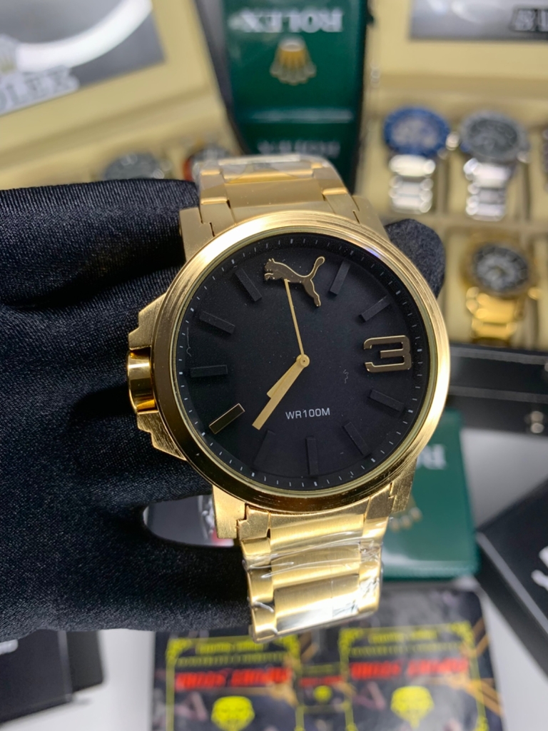 PUMA ULTRASIZE DOURADO 56MM - A PROVA DÁGUA 10ATM