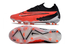 Chuteiras Nike Phantom GX Elite de cano baixo vermelho e preto na internet