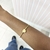 bracelete dourado coração