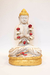 Buda rezando en pedestal