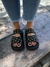 SANDALIA MILA ONDA CUERO NEGRO CON ARANDELAS - Sandalias, zapatos, Botas y Borcegos de mujer con plataforma | Sofia de Grecia