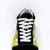 Os tênis Vans Old Skool - Flame são um verdadeiro clássico do estilo casual. Com uma combinação de cores vibrantes em preto, branco e chamas em laranja com amarelo, esses tênis unissex são cheios de personalidade. Feitos com camurça legítima, tecido e cou