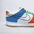 O Nike Dunk Low GS 101 é um tênis unissex colorido, confeccionado em couro legítimo, camurça e tecido. Com ajuste por cadarços e material interno em tecido, proporciona conforto e respirabilidade. Sua versatilidade combina com diferentes estilos. Produto 