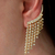 Brinco Ear Cuff Franja de Strass na Cor Cristal Banhado a Ouro 18k