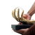 Escultura Mão Dourado Resina com Bola Vidro Decorativa na internet