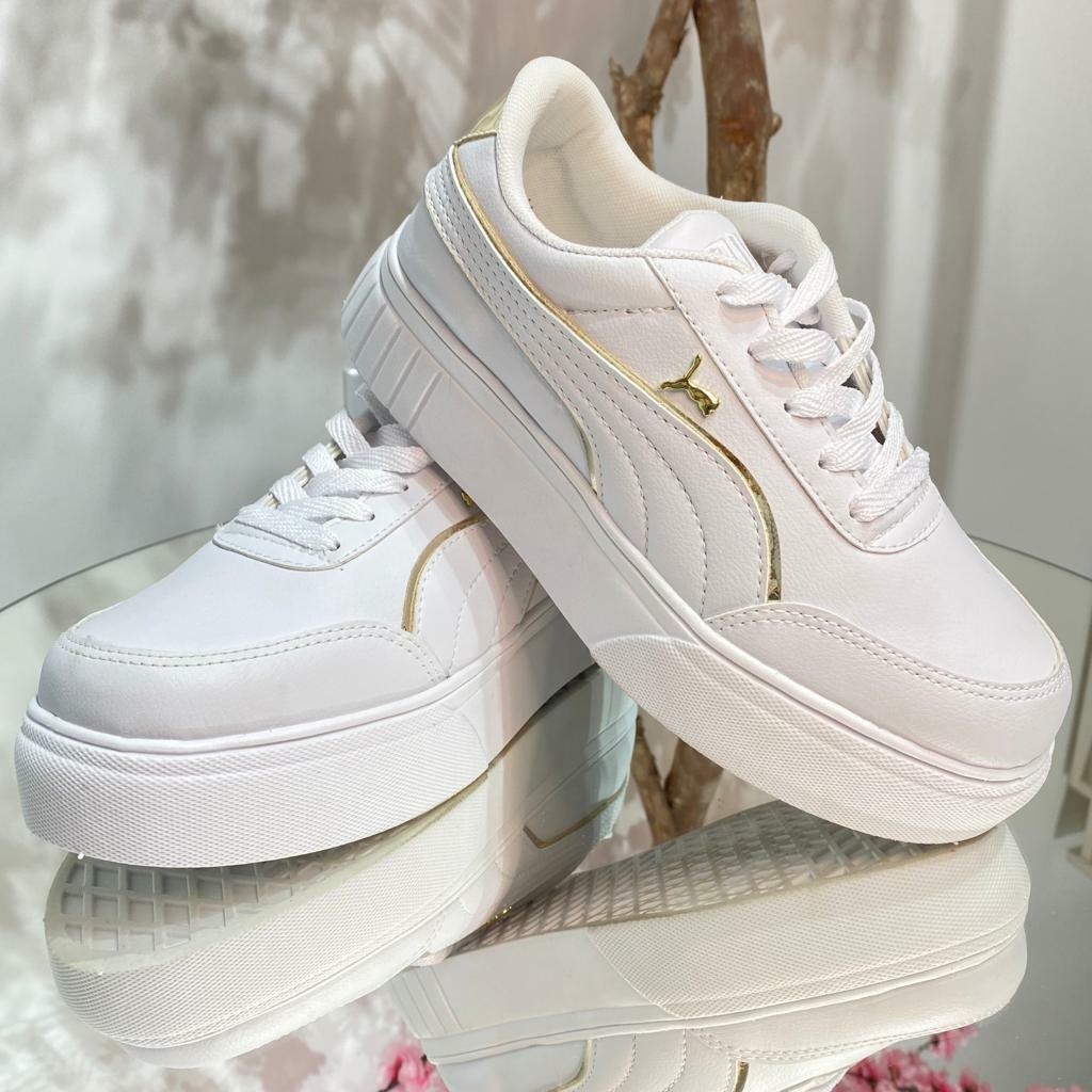 Tenis puma dourado best sale feminino