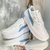 Tênis Puma plataforma branco com detalhe azul - comprar online