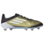 Chuteira adidas F50 Elite FG Messi Triunfo Dorado na cor dourada com detalhes em preto e branco. A chuteira possui cabedal flexível HybridTouch, língua anatômica no formato "burrito" e placa Sprintplate 360 para estabilidade.