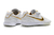 Chuteira Nike Tiempo 10R Society - Branco/Dourado - comprar online
