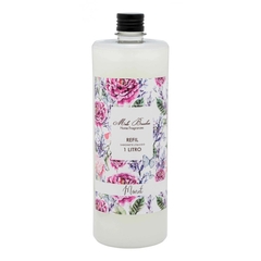 Frasco transparente de refil difusor para ambiente de aroma Monet, com rótulo florido, da marca Mels Brushes, imagem com fundo branco.