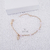 Pulseira infantil com bolinhas e coruja folheada em ouro 18k