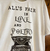 REMERA ALL'S FAIR IN LOVE AND POETRY (TAYLOR) en internet