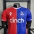 Camisa Crystal Palace Home 23/24 - Masculino Macron Jogador - Vermelho e Azul na internet