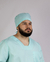 Imagem do pijama cirúrgico para médicos veterinários em tecido Oxford 100% Poliéster, na cor verde água composto por blusa e touca. Ideal para profissionais que buscam conforto e durabilidade em sua rotina de trabalho.
