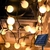 Imagen de Guirnalda de Luz Bolita Blanca 50 led, 7 metros Recargable con Energía Solar - Exterior