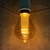 Lâmpada LED Filamento GA70 Bulbo 3w 2000k Âmbar E27 Bivolt - comprar online