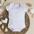 Conjunto de Bebê Body e Calça Canelado Capuc - Branco - comprar online