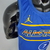 Camiseta regata azul masculina da Nike, modelo All Star NBA 2021, com detalhes em amarelo e logo do Jordan.