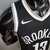 Camiseta regata masculina do Brooklyn Nets, preta e branca, com logo da Nike.