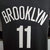 Camiseta regata preta do Brooklyn Nets, com o nome "BROOKLYN" e o número 11 nas costas.