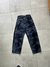 Pantalon de jean baggy azul con recortes y proceso lavado