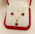 Conjunto Oro 18k cadena, aros y colgante corazón con cubics color rojo - comprar online