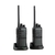 Conjunto de dois rádios comunicadores RC 3002 G2 da Intelbras em suas bases de carregamento.