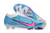 Chuteira Nike Mercurial Vapor 15 Air Zoom FG nas cores Azul e Branco e com detalhes em Rosa.