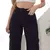 Calça Feminina Sarja Wide Leg Cargo Preto Tendência 2025 na internet